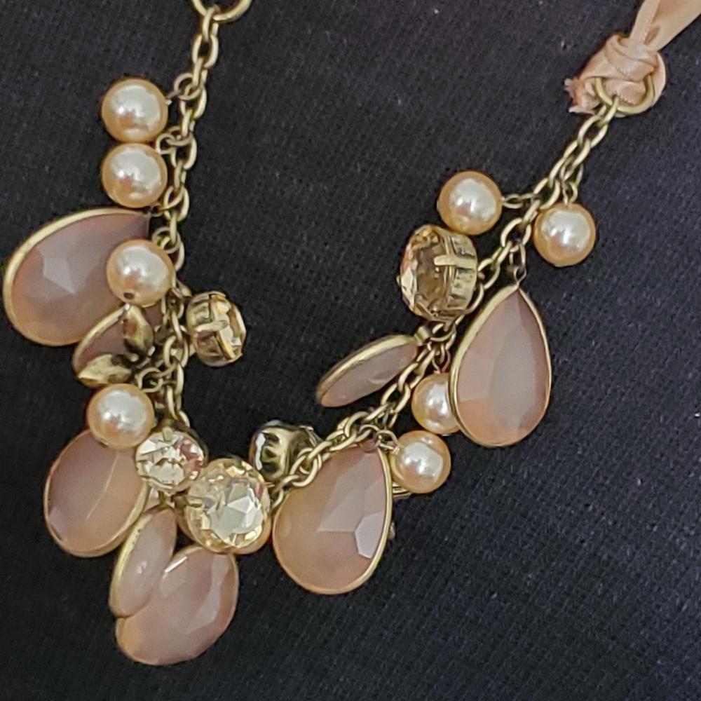 The Loft ribbon with baubles and rhinestones and faux pearls necklace tan